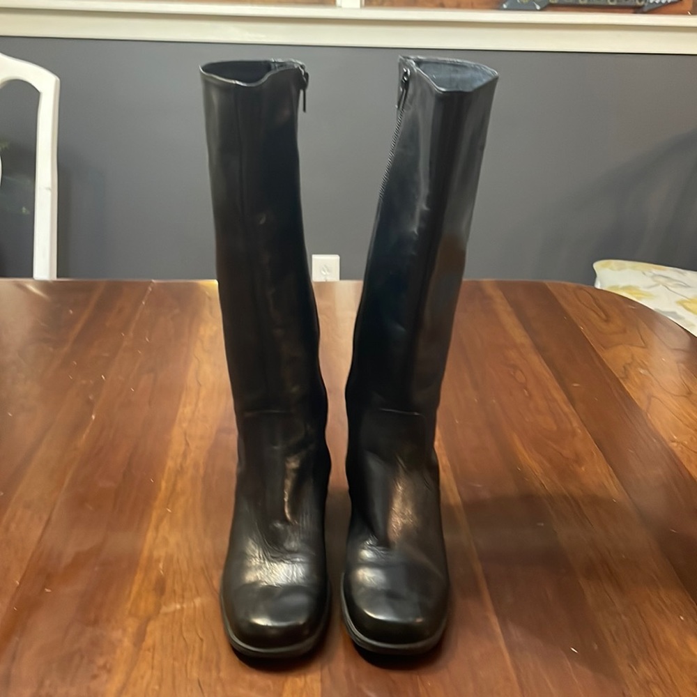 Women’s black leather heeled boots